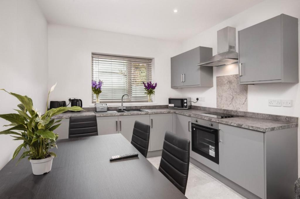 Fully equipped kitchen and dining area in a Blackpool holiday apartment